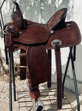 Load image into Gallery viewer, alamo saddlery geo aztec barrel, side view on a metal saddle rack