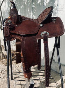 alamo saddlery geo aztec barrel, side view on a metal saddle rack