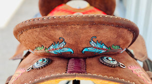 alamo saddlery aztec arrow barrel, close up of back of cantle with arrow tooling and conchos