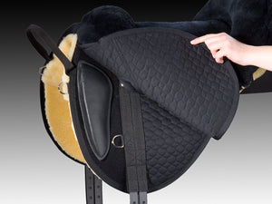 christ cloud special plus fur saddle, anthracite color, side view, underneath flap showing detachable knee rolls and billets, black and white background