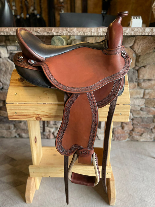 dp saddlery quantum short and light western with a western dressage seat 6003, side view on a wooden saddle rack 