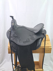 Side view of saddle on wooden saddle rack