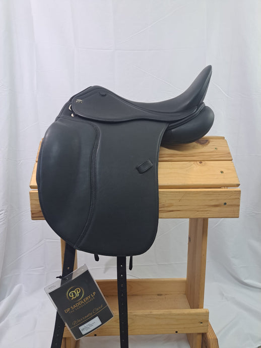Side view of saddle on wooden saddle rack