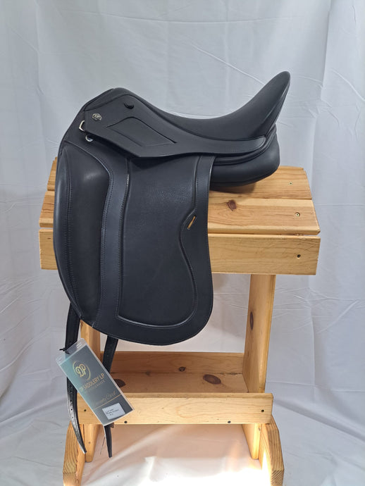 Side view of saddle on wooden saddle rack